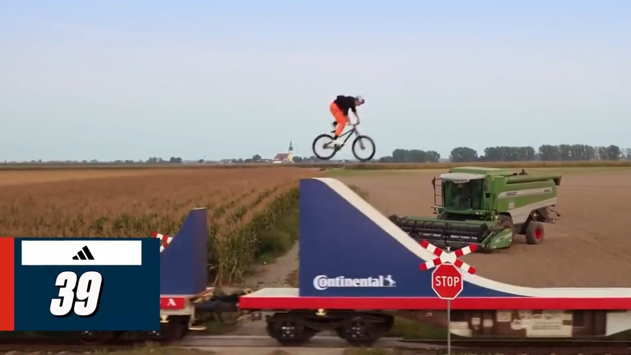 Godziek makes mountain biking history on a 10-car moving train