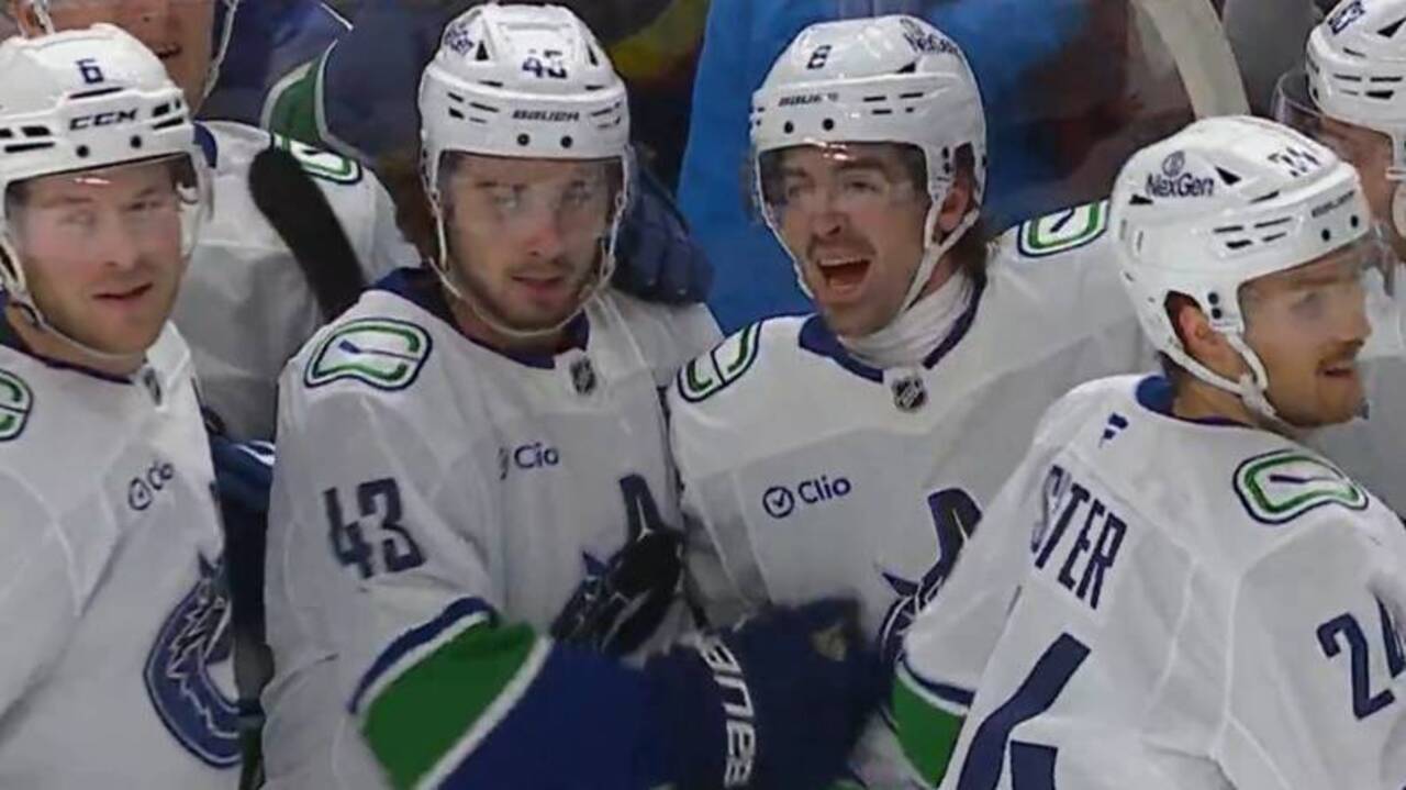 Hughes assists Garland’s OT goal to tie Canucks franchise record